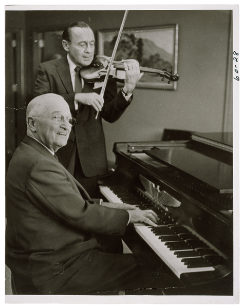 Photograph of President Harry S. Truman Playing the Piano While Jack Benny Plays the Violin
