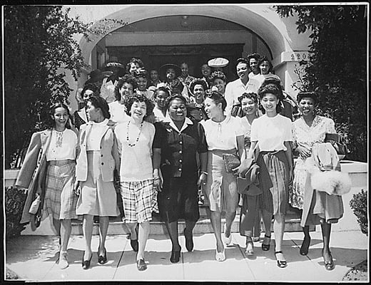  "Hattie McDaniel (center), Chairman of the Negro Division of the Hollywood Victory Committee, takes time off from rehearsals...to lead a caravan of entertainers and hostesses to Minter Field,...for a vaudeville performance and dance for soldiers stationed there. The young lady to the right of Miss McDaniel is Miss Virginia Paris, noted concert singer." 