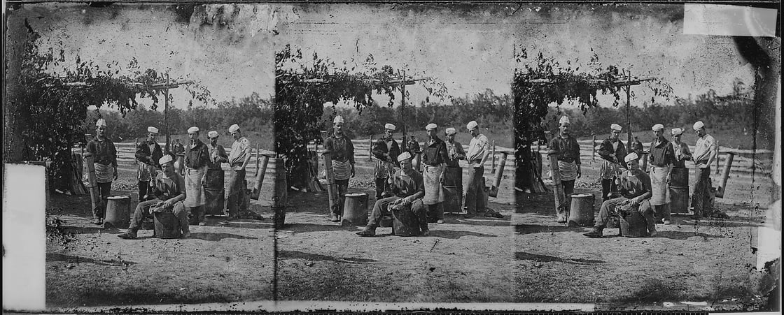 Black and white photograph of an outdoor camp scene during the Civil War, soldiers cooking at the site. The image is shown in triplicate.