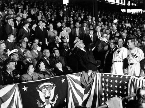 Truman pitches baseball from stands