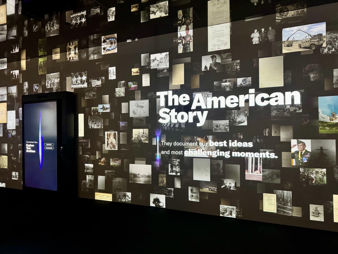 The Cosmos gallery within The American Story shows a large digital display filled with scans of National Archives records. A portal is shown on the left, a digital tool that offers visitors opportunities to personally connect their lives to our nation’s storied past.