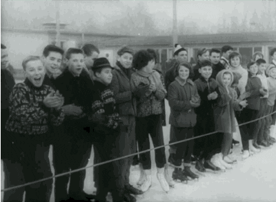 Animated GIF of a group of people outside by an ice rink clappingates