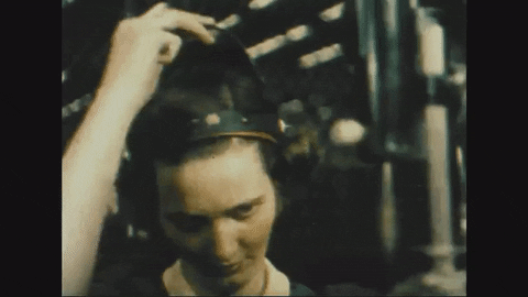 Animated gif of a woman pulling a protective mask over her face