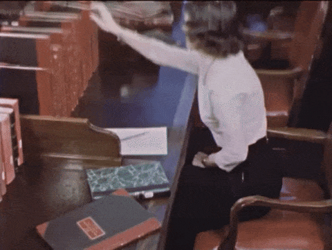 researcher paging through a large volume