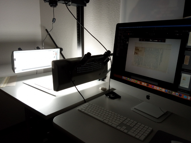 Chinese Exclusion Act case files being digitized by a scanner donated by the Chinese Historical Society of Southern California. (Photo courtesy of the National Archives at Riverside staff.)