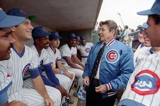  President Ronald Reagan talking to the Chicago Cubs baseball players in the dugout during a trip to Illinois and attending a Chicago Cubs and Pittsburgh Pirates baseball game at Wrigley Field